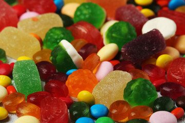 Bright candy lollies on white background	