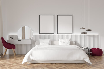Bright bedroom interior with two empty white posters, bed
