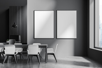 Dark office room interior with two empty white posters, desktops
