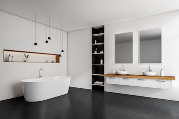 Fototapeta premium White bathroom interior with bathtub, sinks and mirrors, shelf with accessories