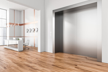 White office entrance with elevator and reception desk