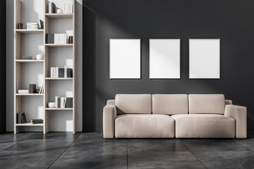 Dark living room interior with three empty white posters