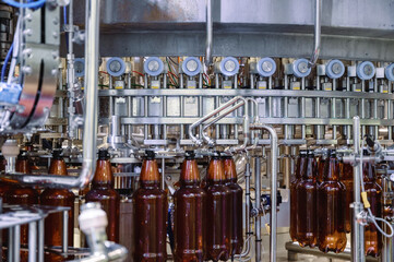 Large filling machine, the process of filling plastic bottles with various drinks.