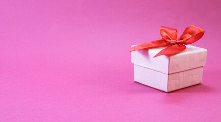 Gift box on pink background