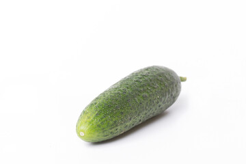 whole green cucumber isolated on white background close up front side view