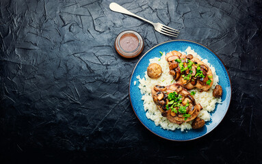 Chicken with marsala sauce and rice