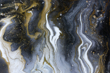 Marble gray and black abstract acrylic background with gold dust.