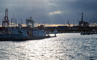 VALENCIA, SPAIN – DECEMBER 5, 2021:View of Valencia port across the channel, Valencia, Spain.