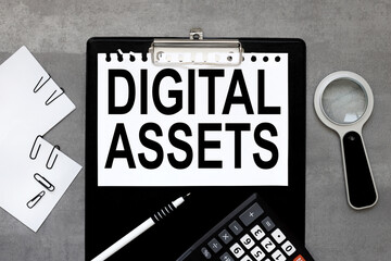Digital Assets . black clipboard, with a white sheet of paper on a gray background. calculator. magnifying glass. business concept