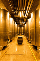 Modern winery interior with aluminium stainless steel wine vats in a row inside the winery, Klet Brda, Slovenia. - obrazy, fototapety, plakaty