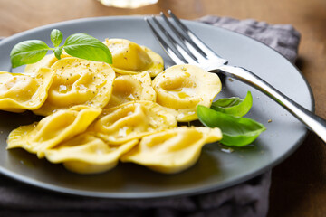 Boiled ravioli with fresh basil