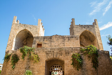 Puerta de Mallorca (Porta de Mallorca), ancient stone building with two towers, important sight at Alcudia, Mallorca island, Spain