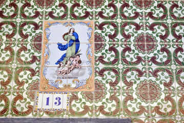 Wall with Patterned Tiles and Number '13'