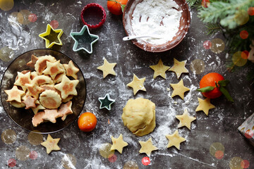 Cooking cookies for the new year and christmas. Flour and dough, cookie cutters. Top view. Copy space