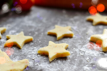 Cooking cookies for the new year and christmas. Flour and dough, cookie cutters. Top view. Copy space
