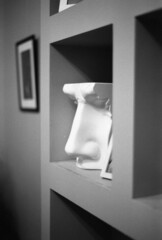 interior black and white photo with a little sculpture