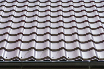 View of the new tiled roof. Blank background for text and design. Exterior of a country house. Copy space