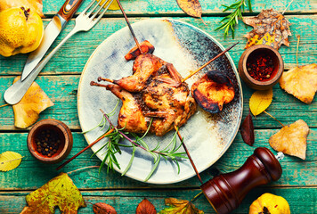 Quail barbecue with quince