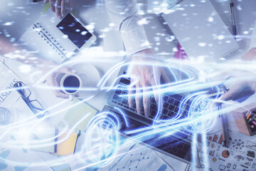 Double exposure of man's hands typing over computer keyboard and automobile theme hologram drawing. Top view. Technology concept.