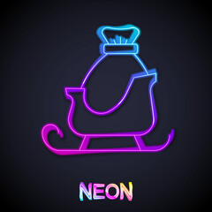 Glowing neon line Christmas santa claus sleigh with sack bag icon isolated on black background. Merry Christmas and Happy New Year. Vector