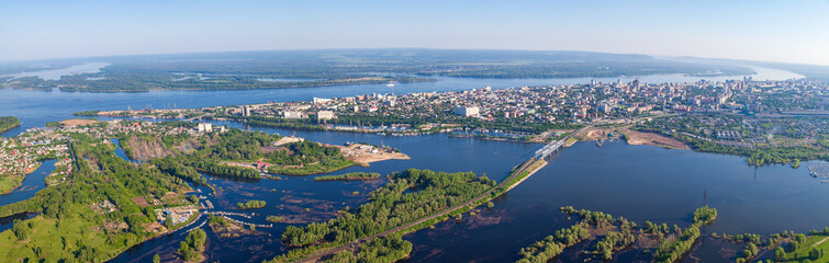 Fototapeta na wymiar Panorama of the city of Samara From the air, a view of the Volga River and the Samara River, bridges of the city of Samara. Samara, Russia.