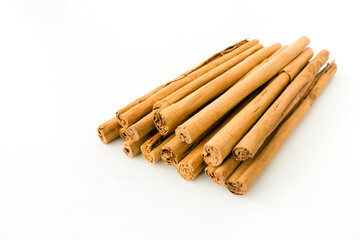 Long Ceylon Cinnamon Sticks isolated on White Background - obrazy, fototapety, plakaty