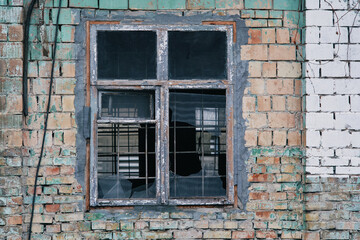 Fototapeta na wymiar Broken window of an old brick house. Kiev, Ukraine.