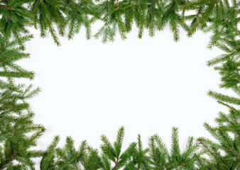 Simple Christmas frame made of fir branches on white background