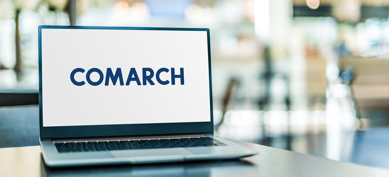 Laptop computer displaying logo of Comarch
