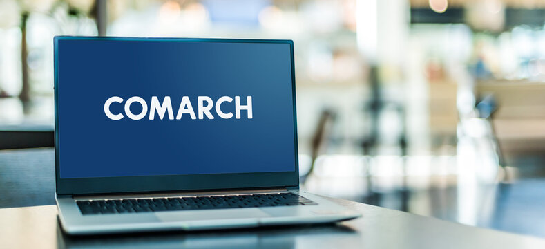 Laptop computer displaying logo of Comarch