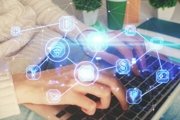 Double exposure of woman hands typing on computer and social network theme hologram drawing. People media concept.