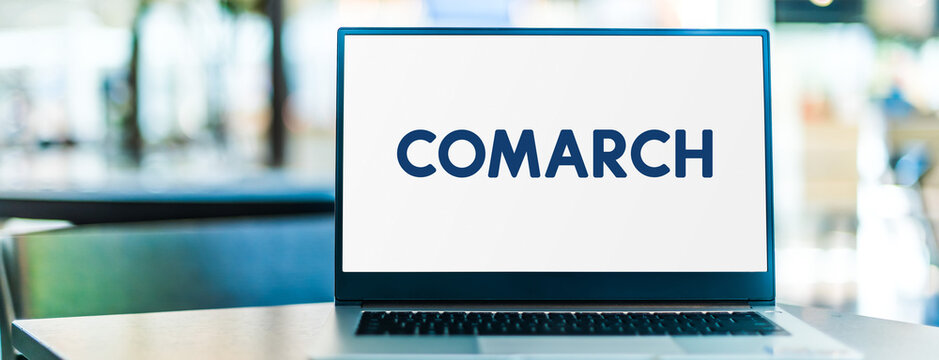Laptop computer displaying logo of Comarch