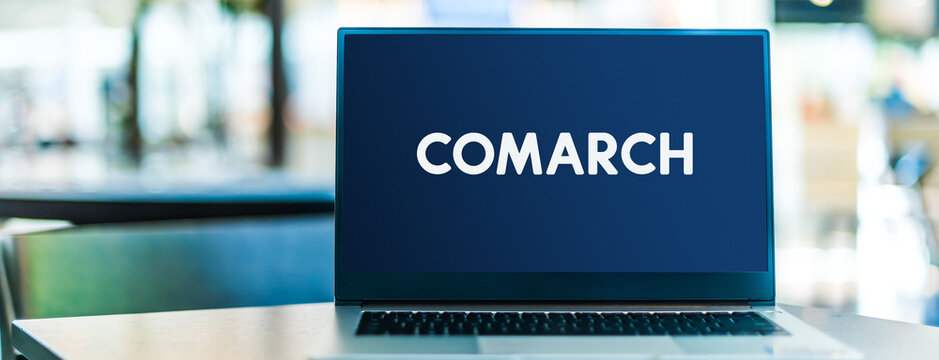 Laptop computer displaying logo of Comarch