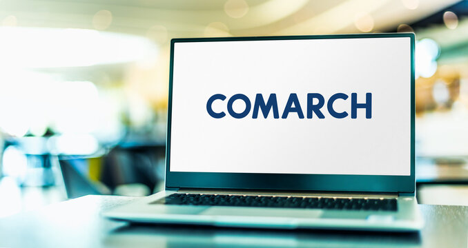 Laptop computer displaying logo of Comarch