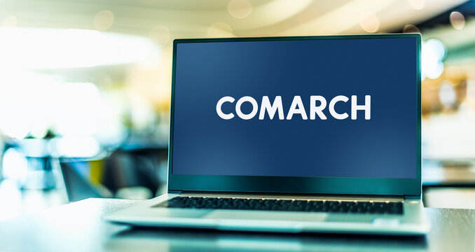 Laptop computer displaying logo of Comarch