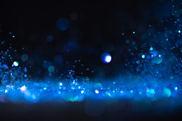 background of abstract blue glitter lights. defocused
