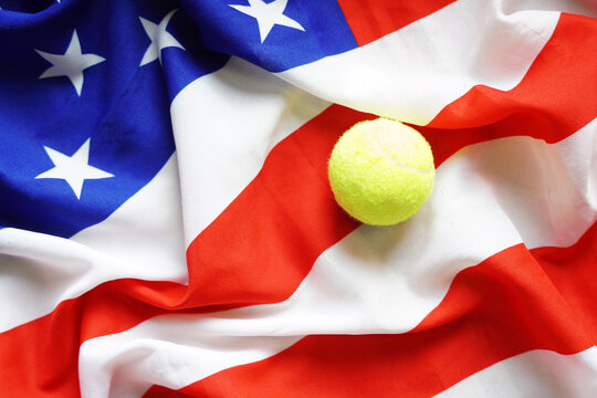 US tennis open concept. American tennis background with USA Flag and tennis ball.