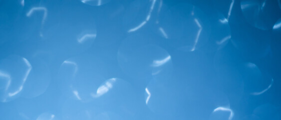 abstract glitter silver, blue lights background.