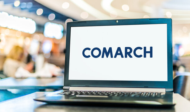 Laptop computer displaying logo of Comarch