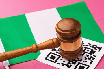 Judge gavel, barcode sheet and Nigerian flag, concept of administrative punishment for violation of...