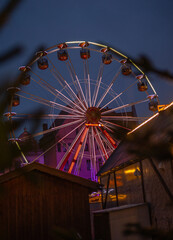 ferris wheel at night in a cityscape