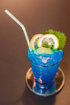 Blue cocktail drink with ice.