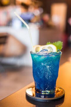 Blue cocktail drink with ice.