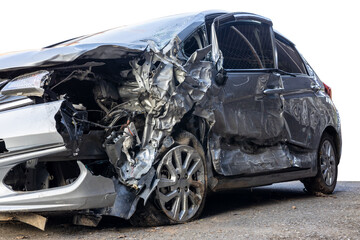 Low side view of a sedan that was smashed in a fatal collision.