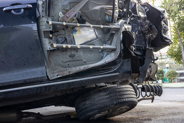 Fototapeta premium Close-up background of a black car wrecked in a fatal collision.