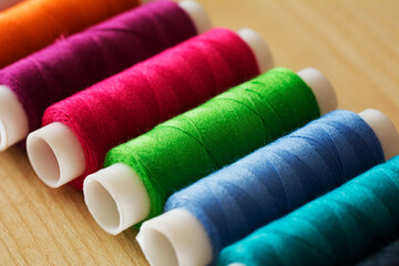 Fototapeta na wymiar Many multicolor sewing threads, Yarn textile, Spool.
