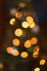 Bokeh of Christmas tree with lights and decorations with soft focus