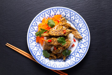 Food concept homemade Turmeric Stir Fried Beef with rice on black slate stone board with copy space