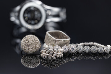 Fototapeta premium Elegant women's watches in a metal case and jewelry made of silver