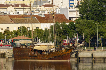 Vintage restored Caravel ship anchored in the docks of Portimao city, Portugal